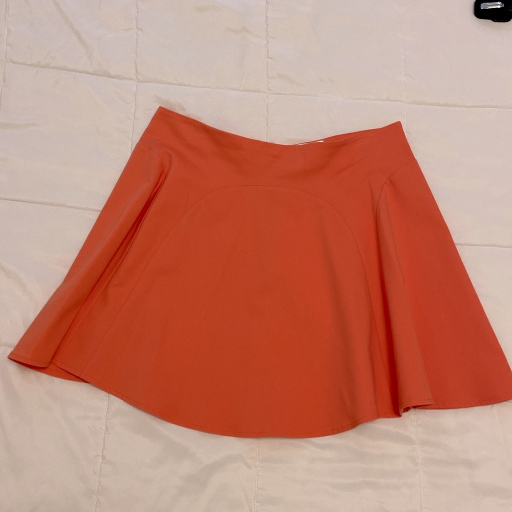 Parker pleated skater mini skirt in coral/melon color size L